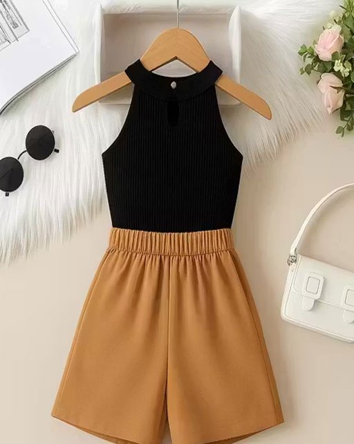 Stylish sleeveless black top paired with a light beige skirt perfect for a summer outing or casual brunch